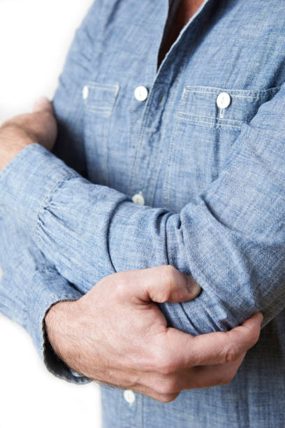 istock Close Up Of Man Suffering From Tennis Elbow 914810294