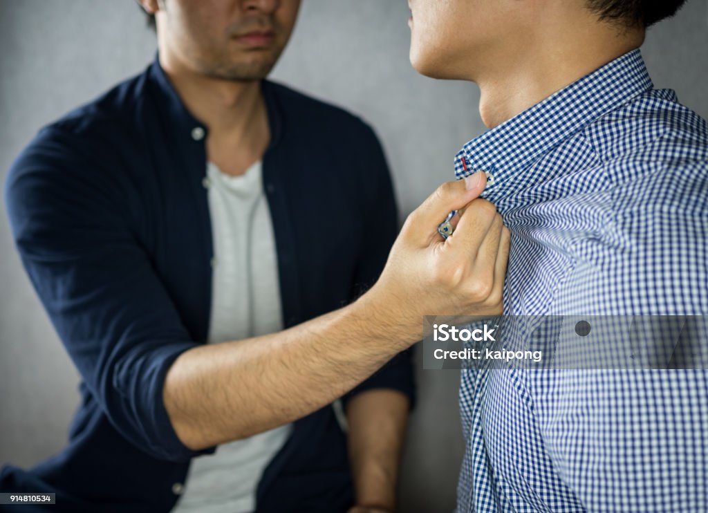 Man grab other by the collar, having argument Violence Stock Photo