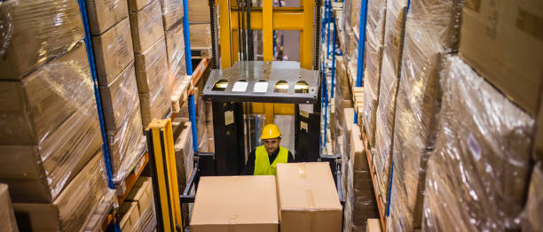 istock Stacks of boxes on warehouse shelves 914810550