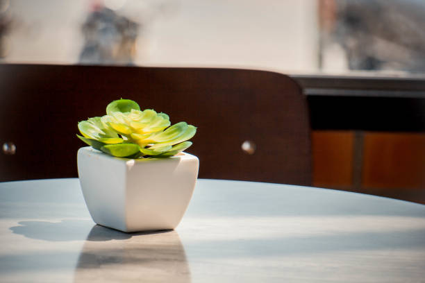 istock Decorative ceramic White vases on wooden table, vintage tone 914813858