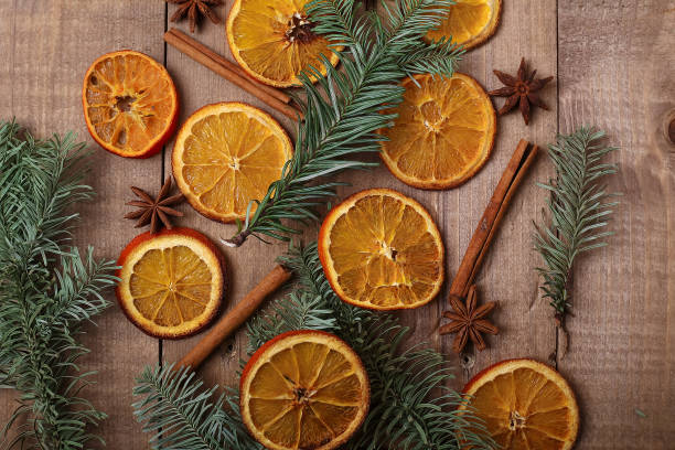 istock Dry slices of oranges lying on the table. Decorative ornament. C 914817474