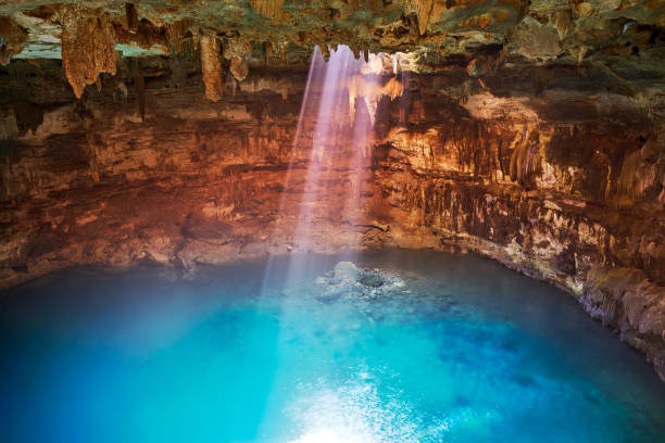 Cenote Samula sinkhole in Valladolid Mexico Cenote Samula sinkhole light beam near Valladolid in Yucatan Mexico valladolid mexico photos stock pictures, royalty-free photos & images