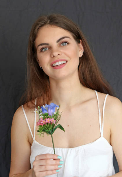istock Woman And Flowers 914818508