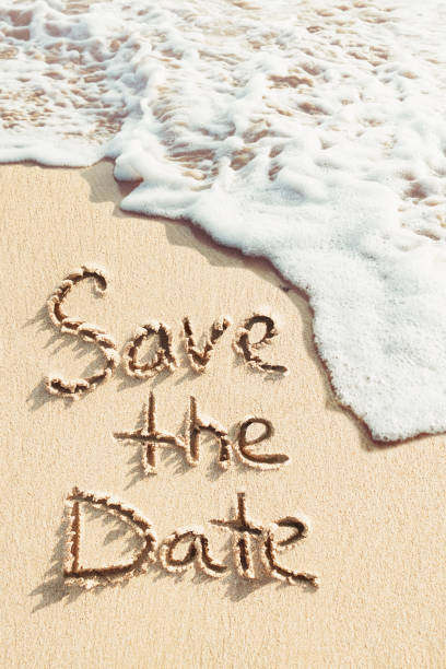 istock Save the date written on the beach 914818654
