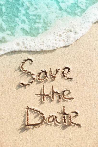 istock Save the date is written on the sand 914818718