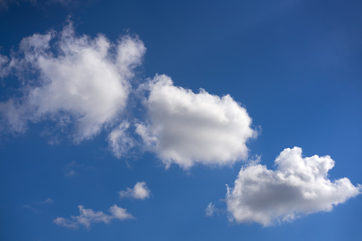 Blue summer sky white cumulus clouds background