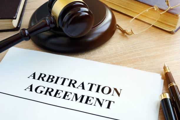 istock Arbitration agreement resolution of commercial disputes on a desk. 914821794