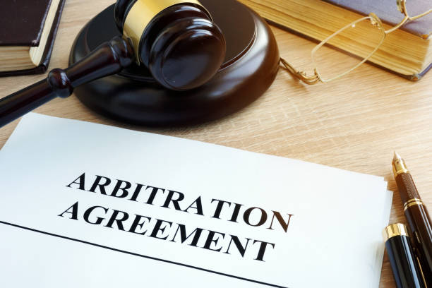 Arbitration agreement resolution of commercial disputes on a desk. Arbitration agreement resolution of commercial disputes on a desk. mediation stock pictures, royalty-free photos & images