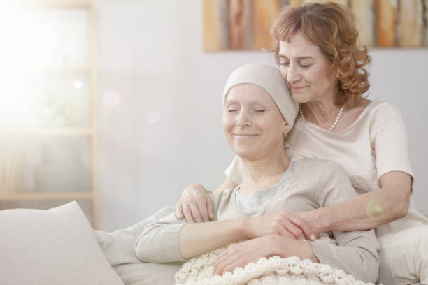 istock Mother hugging happy sick woman 914821914