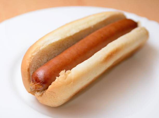 Hot dog in a plain bun stock photo