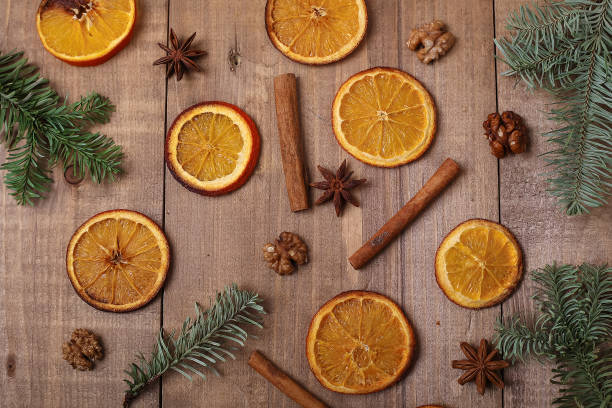 istock Dry slices of oranges lying on the table. Decorative ornament. C 914823716