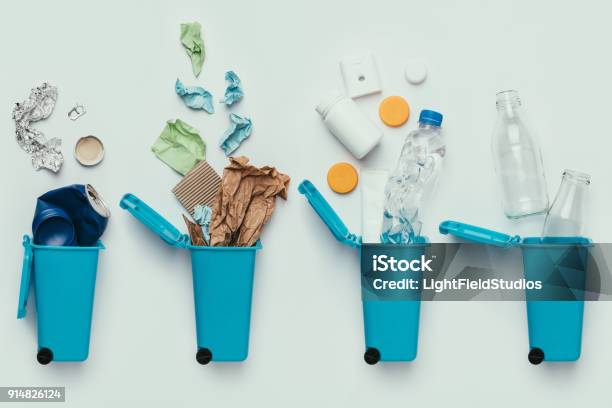 Top View Of Trash Bins And Assorted Garbage Isolated On Grey Recycle Concept Stock Photo - Download Image Now