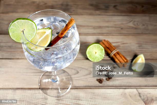 Gin Tonic On Wood Background Stock Photo - Download Image Now - Gin, Cinnamon, Gin Tonic
