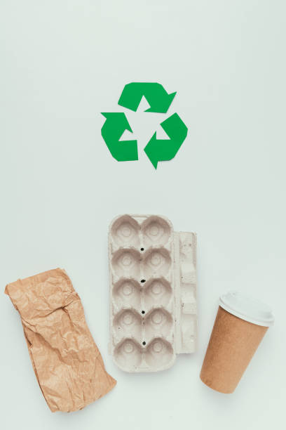 istock flat lay with recycle sign and disposable trash isolated on grey 914826868