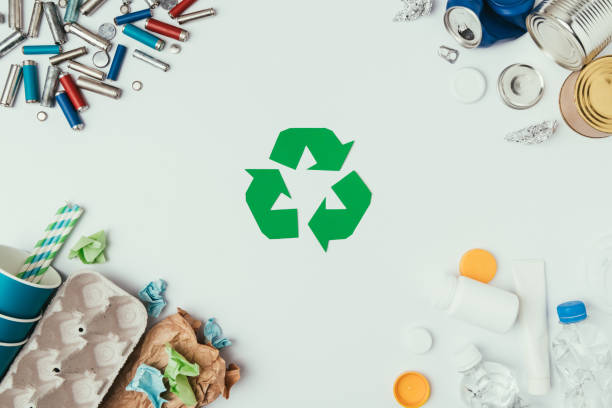 istock flat lay with arranged different types of garbage and recycle sign isolated on grey 914827394