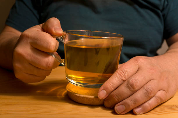 istock hands holding hot cup of tea 914830520