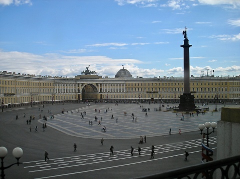 St Petersburg, Russia, 20th June 2004.   I took this picture of the large open parade and promenading area outside of the old Czars' 'Elizabethan Baroque style' palace, on a June afternoon, when clouds had just covered the sun.  It is a very beautiful 18th century building, with a huge crescent-like sweep, designed in the main by the Italian architect Francesco Bartolomeo Rastrelli, his input occurring between 1754 and 1762. 