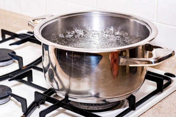 istock Boiling water for soup in modern saucepan 914834374