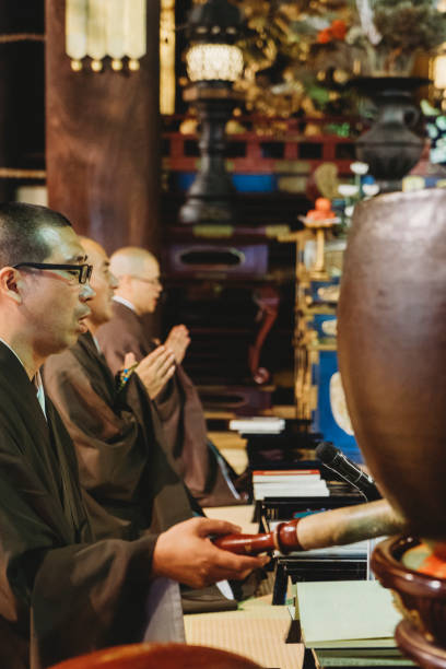 istock Monks praying in a Japanese temple 914835500