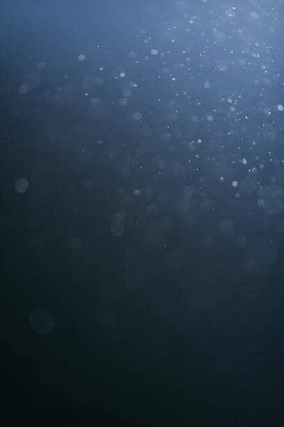 istock real backlit dust particles with blue toned flare 914839738