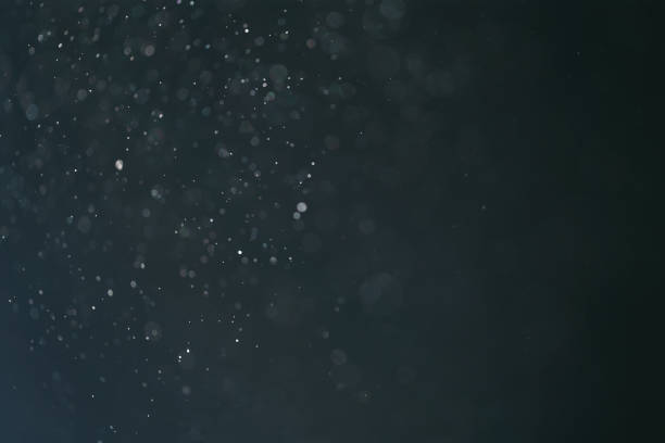 istock real backlit dust particles with blue toned flare 914839788