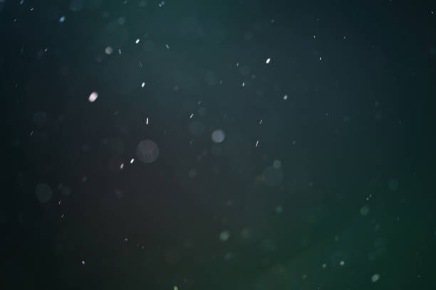 istock real backlit dust particles with teal toned flare 914842142
