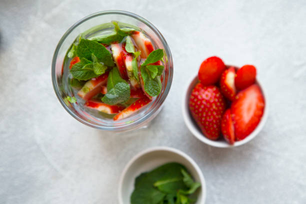 istock Detox water on light concrete background 914842794