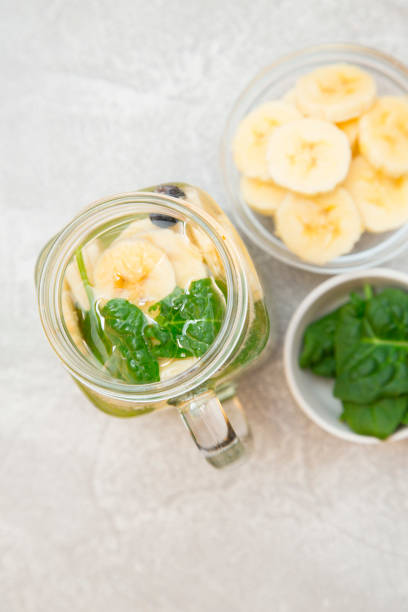 istock Detox water on light concrete background 914843552