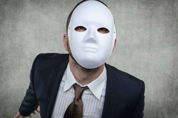 istock Businessman in a mask 914846100