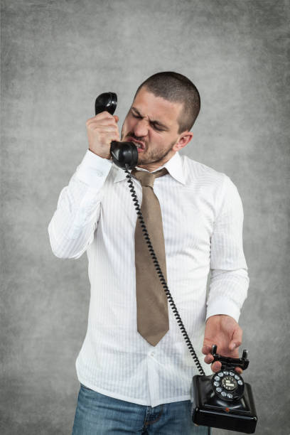 istock angry businessman screaming on the phone 914846266