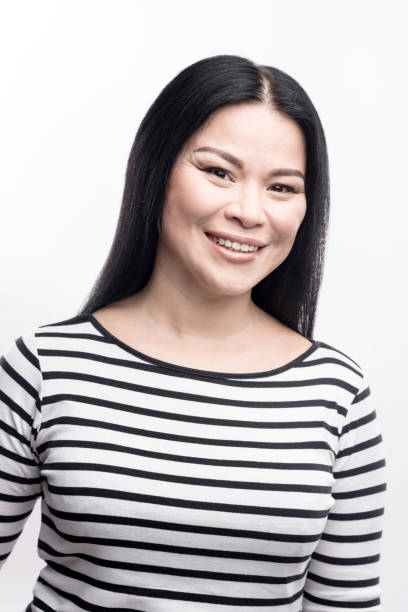 istock Studio shot of beautiful dark-haired woman smiling 914846816
