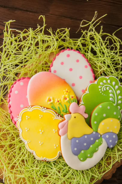 istock Colorful Easter egg cookies. Wooden background. Top view. 914847174