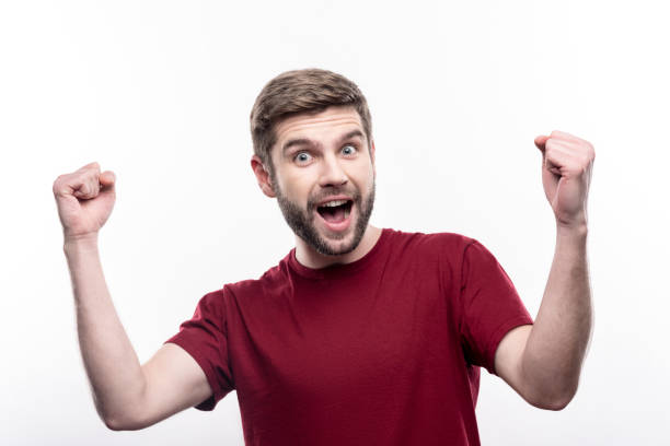 istock Happy man raising his hands in triumph 914847272