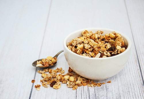 Bowl with granola  on a old wooden table