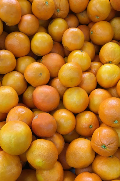 istock yellow tangerines on a tray close up 914851276