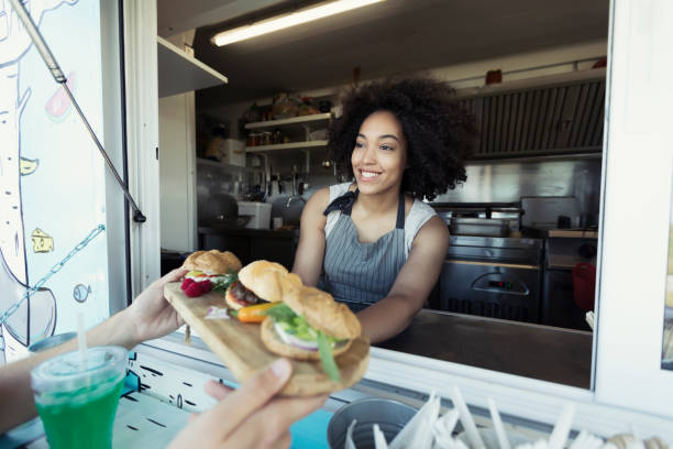 istock Food van worker giving order to customer 914851438