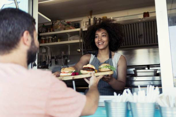 istock Food van worker giving order to customer 914851440