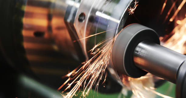 istock Finishing metal working on high precision grinding machine in workshop 914855940