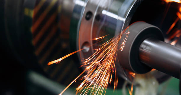 istock Finishing metal working on high precision grinding machine in workshop 914855960