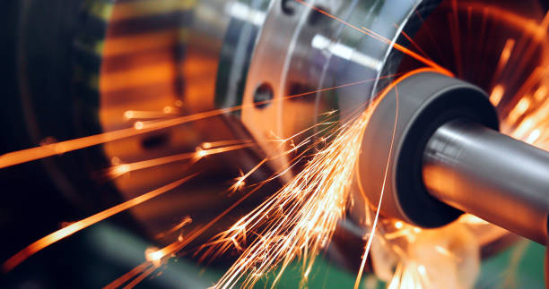 sparks flying while machine griding and finishing metal - steel material metal iron imagens e fotografias de stock