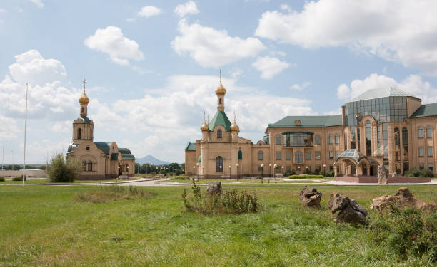 Summer landscape. The factory building and the church Stavropol, Russia-5 August, 2013: Plant for bottling of mineral water and soft drinks JSC "Rokadovskie mineral water" stavropol stavropol krai stock pictures, royalty-free photos & images