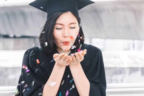 istock Happy woman students celebrating successful graduation 914859696