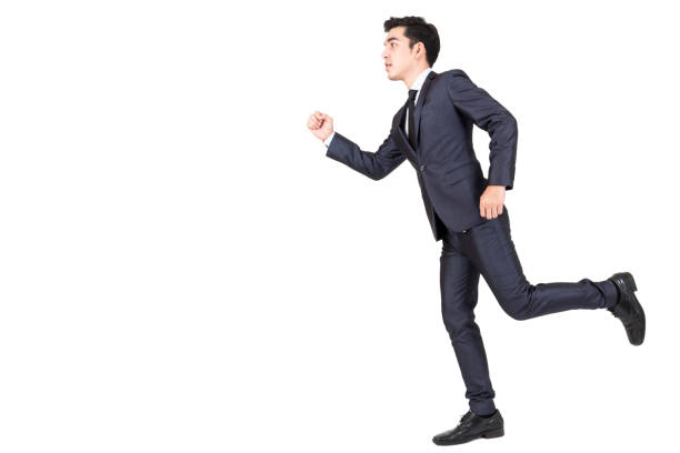 istock Businessman running forward isolated on white background 914859728