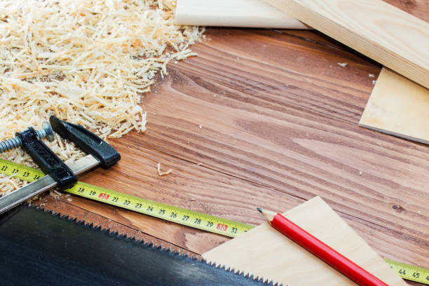 istock many wooden bricks full of sawdust. On old scratched wooden table, work tools concept 914860132