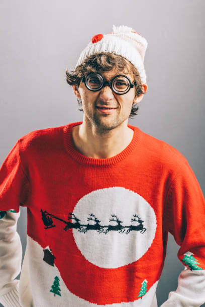 istock Grumpy man in funny christmas clothes and glasses. 914863320