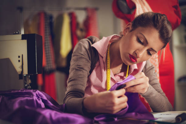 Young Woman Tailor Sewing