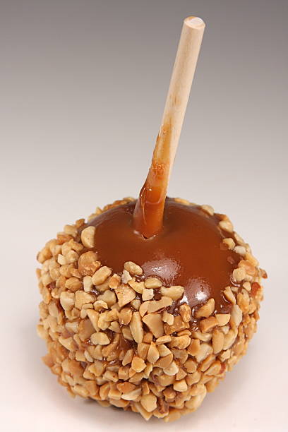 istock Nutty Taffy Caramel Apple Close Up Isolated On White 91486764
