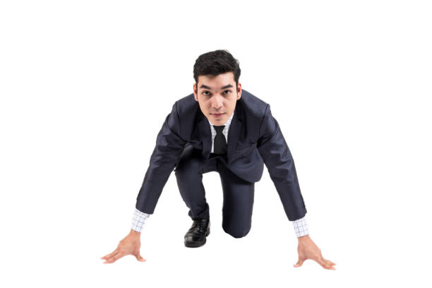 istock Businessman ready to run isolated on white background 914871048