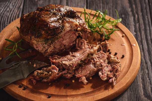 istock Roasted lamb fillet on wooden background. 914871372