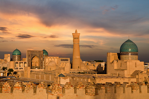 View over the Poi Kalon Mosque and Minaret at the sunset, in Bukhara, Uzbekistan.